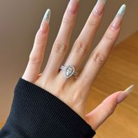 Anillo de Compromiso de Plata de Ley con Diseño de Dylam Charm, Bañado en Rodio y Oro de 14K, con Circonita Cúbica 5A en Forma de Lágrima
