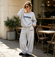 Ensemble décontracté deux pièces en molleton gris chiné pour femme avec logo personnalisé OEM : sweat-shirt ample à épaules dénudées et pantalon de survêtement à cordon de serrage