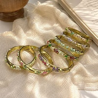Nouveau bracelet tendance pour femme, style chinois rétro, inspiré du palais, en alliage de zinc électroplaqué, avec fleur émaillée et motif goutte d'huile