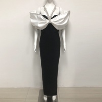 Robe de soirée de luxe élégante noire à épaules dénudées, longue, ornée de strass, moulante, avec grand nœud blanc