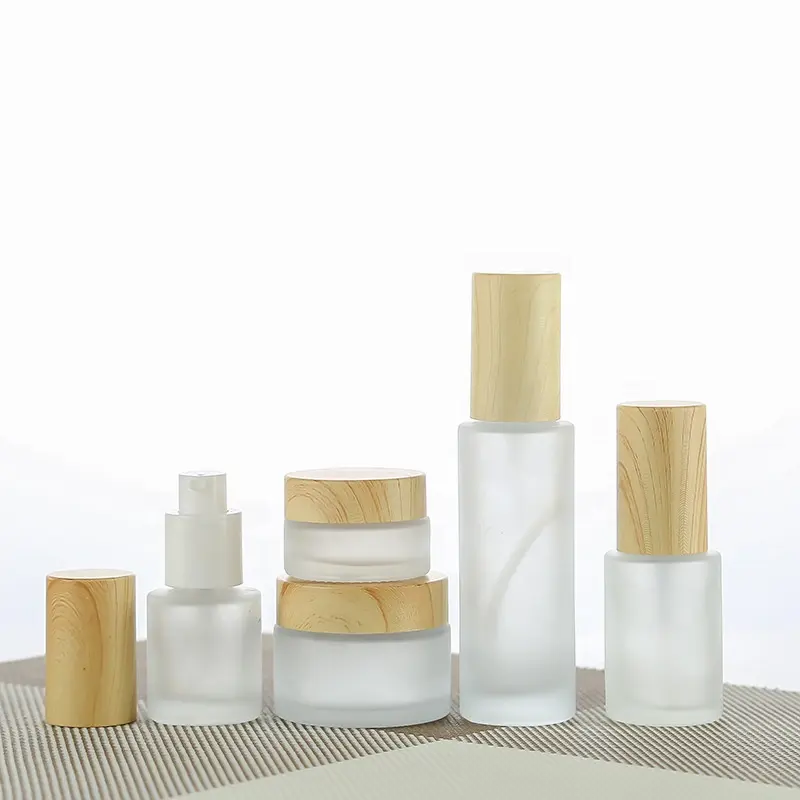 LZ paketi mezgit yüz göz kremi ambalaj özel Logo kozmetik yüz Mist sprey cam pompalı losyon şişeleri ile ahşap tahıl üst