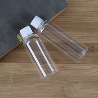 Bouteilles en plastique PET vides et rechargeables de 10/100 ml avec pompe pulvérisatrice sérigraphiée pour cosmétiques – Idéales pour le voyage et le stockage de liquides et de lotions