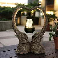 Sculpture en résine d'éléphant en forme de coeur ornement de lanterne éclairée Statue d'anime de Style dessin animé abstrait pour jardin
