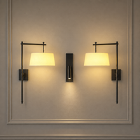 Lampe murale de luxe moderne pour hôtel et maison, avec abat-jour en métal et tissu, idéale pour la lecture au chevet ou comme éclairage d'appoint.