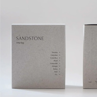 Boîte en papier d'emballage personnalisée, design luxueux et élégant, boîte en papier d'emballage pour café gris avec impression de logo en relief