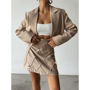 Jupe crayon droite en cuir beige et lin avec design bandage, ruban perlé et décoration à paillettes - Product Image 1