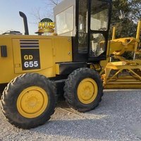 Niveleuse à moteur KOMATSU GD655 d'occasion, 17 tonnes, engin de construction avec moteur pour le nivellement des routes