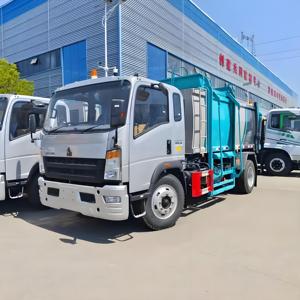 Camion compacteur de déchets à chargement latéral, 6 tonnes, 4x2, Sinotruk Howo, durable, fiable, véhicule neuf pour la collecte et le recyclage des déchets - Product Image 1
