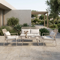 Ensemble de salon de jardin en rotin 4 pièces avec structure en acier thermolaqué et assise en osier tressé pour l'extérieur