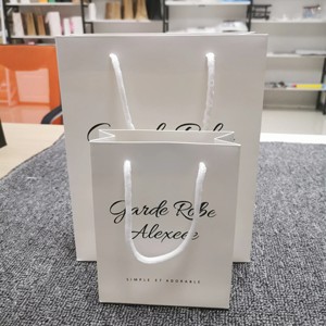 Wholesale Custom Logo Boutique Embossed Black Pink Gift Bags Bulk Retail Shopping T-shirt Gift Garment Shoes Cosmetic Paper Bag - Product Image 1