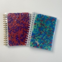 A5 vente en gros spirale liquide huile flottant cahier couverture en PVC souple avec des boules de PVC rouge bleu vert