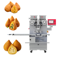 Machine automatique pour la fabrication de boules de pâte à mochi, de tamales fourrés à la confiture, de biscuits bicolores et de produits à enrober