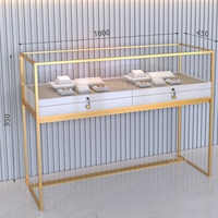 Vitrine à bijoux en or sur pied personnalisée en acier inoxydable avec éclairage LED pour magasin de bijoux