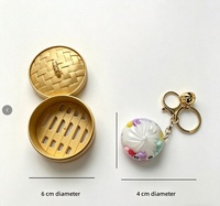 Neuer Mini Süßer Dumpling-Schlüsselanhänger mit fließendem Sand-Design, Quetschspielzeug zur Stresslinderung, bunter Taschenanhänger, 4,5x2,3cm