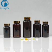 Bouteille en plastique ronde ambre de 150ml avec bouchon en or de luxe, conteneur de pilules en PET pour suppléments capsules pilules emballage conception OEM