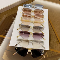 Lunettes de soleil œil-de-chat triangulaires sans monture, incrustées de diamants, protection UV400 pour femme, nouveau style européen et américain