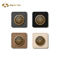 Étiquette en cuir personnalisée Jinyi avec logo métallique, bordure carrée cousue, design de marque, accessoires pour hijabs, fabrication OEM