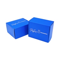 Caja de Envío Azul Personalizada con Logotipo Estampado en Plata para Perfumes, Fabricada con Cartón Corrugado Tipo E, Ideal para Suscripciones de Fragancias