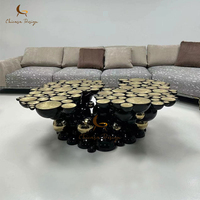Table basse moderne de luxe écologique et durable, forme irrégulière, en acier inoxydable noir et or, pour salon