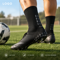 Chaussettes de football renforcées noires mi-mollet avec coussinets internes et externes pour une adhérence optimale sur le terrain, profil mince, adaptées aux crampons, avec tableau de tailles
