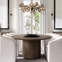Elegantes Luxuriöses Modernes Möbelset mit Rundem Esstisch auf Sockel und Stoffbezogenen Esszimmerstühlen mit Gebogener Rückenlehne