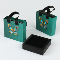 Boîte cadeau en carton de papier d'art personnalisé pour bijoux montre emballage avec tiroir coulissant UV estampage à chaud poignée de ruban doublure en éponge