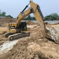 Excavatrice sur chenilles 320GC d'occasion, 27,5T, en bon état de fonctionnement, avec pompe hydraulique et roulement, pour travaux lourds de terrassement en carrière