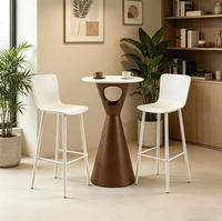 Table basse circulaire moderne minimaliste à pieds hauts pour l'extérieur, idéale pour les cafés et les espaces de loisirs