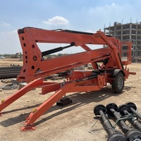 Plateforme élévatrice articulée remorquable robuste avec système hydraulique stable pour des travaux à grande hauteur dans les entrepôts et sur les chantiers de construction