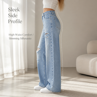 Jean large déchiré bleu clair pour femme, taille mi-haute, coupe ample, en denim délavé, style vintage tendance, jambe droite
