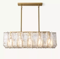 Lustre rectangulaire de luxe en verre transparent épais avec finition dorée, idéal pour hôtel, salle à manger, salon, restaurant