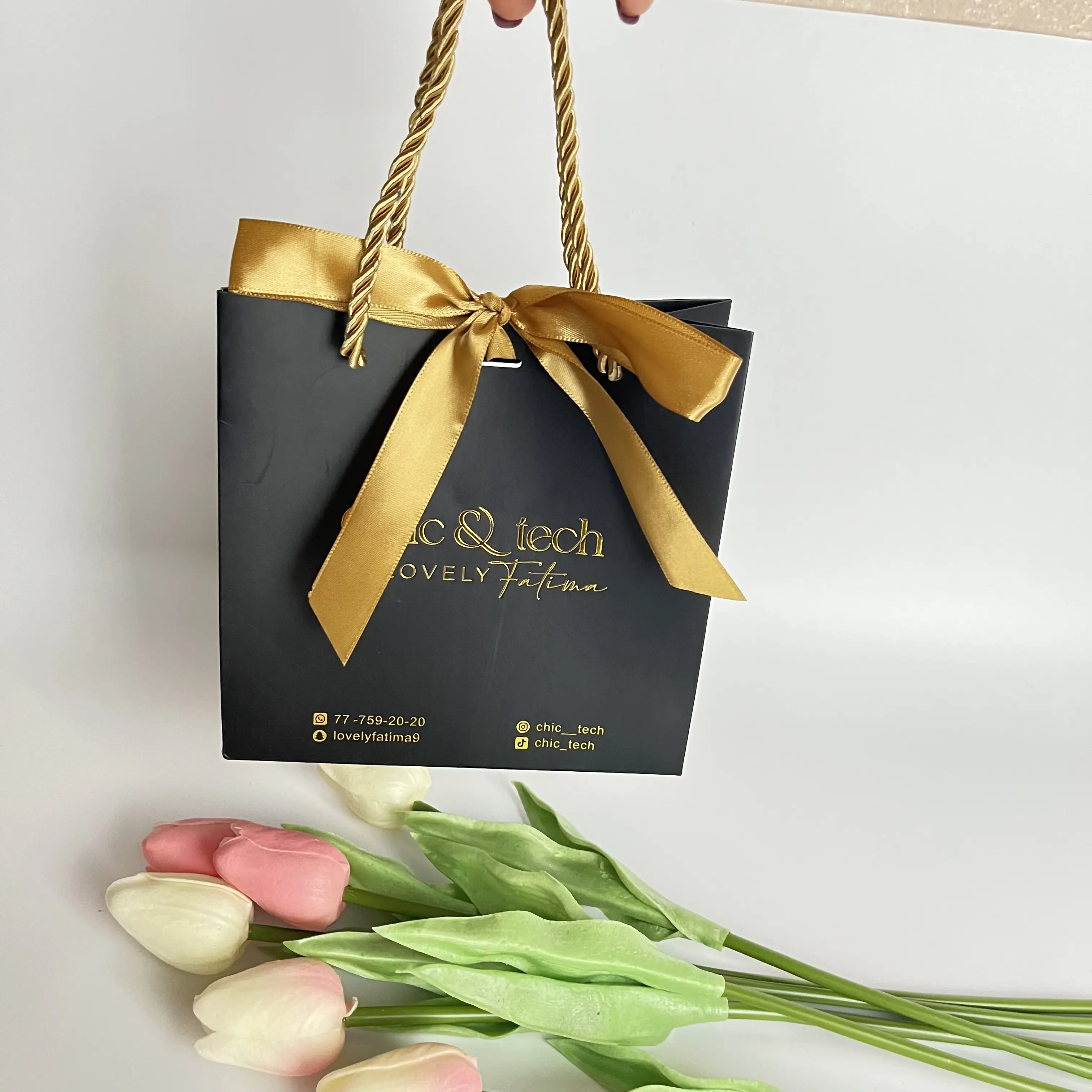 customized packaging cloth gift shopping paper bag small black gift bag with golden logo hot foiled luxury paper bag with ribbon