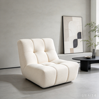 Fauteuil lounge moderne en bouclette avec revêtement doux au toucher, design modulaire pour salon de luxe et hôtel