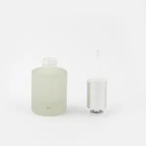 Fábrica al por mayor 30ml logotipo personalizado botella cuentagotas de vidrio botella de aceite esencial de aluminio con botón de presión