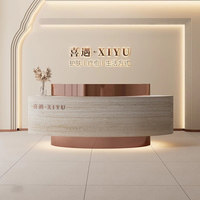 Bureau de réception de salon de beauté de forme ovale au design de luxe avec Led Bureau de réception moderne en acier inoxydable noir blanc pour le bureau