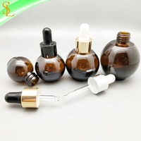 Flacons compte-gouttes en verre ambré uniques 10ml 20ml 30ml 50ml bouchons compte-gouttes en caoutchouc en forme de boule pour la sérigraphie d'huiles essentielles