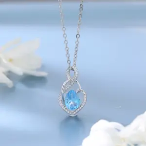 Colgante de plata esterlina de nuevo diseño con diamantes delicados encantos en forma de corazón de Tapaz azul suizo para mujer