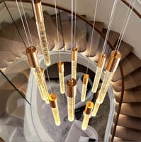 Long lustre de lampe d'escalier de luxe simple moderne avec phare rotatif en métal rond en verre pour Villa Loft Appartement Salon