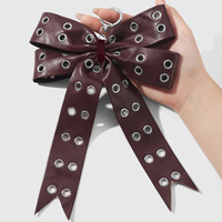 Porte-clés et pendentif de sac rétro, style doux et cool, avec motif léopard, motif laitier, motif œil, couleur unie et nœud