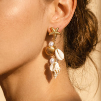 Boucles d'oreilles pendantes en acier inoxydable plaqué or avec perles tournesol, étoiles de mer et coquillages – Bijoux fantaisie chic à la française pour femme