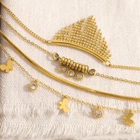 Collier superposé en acier inoxydable plaqué or 18 carats avec pendentif papillon en zircon cubique et chaîne chevrons pour femme, vente en gros OEM