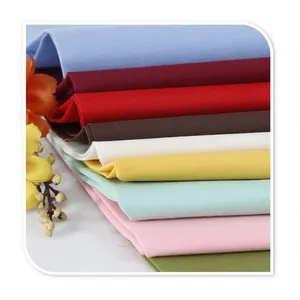 Indonesia Plain dyed soft woven cheap 130 gsm 100% cotton poplin fabric for dress/shirt
