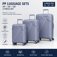 Valise rigide PP grise à roulettes, coque géométrique, poignée latérale, marque privée, assortiment de détail