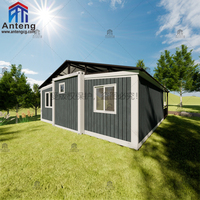 Maison conteneur préfabriquée pliable et extensible à panneaux sombres avec grande véranda, cabane spacieuse pour invités, idéale pour les vacances dans le jardin
