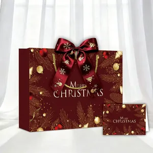 Tas Hadiah Natal dengan Detail Pita Merah, Detail Salju, Pegangan Tali Emas, dan Desain Pohon Natal untuk Kemasan Musiman - Product Image 1