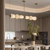 Lustre en marbre et cuivre, long, à une seule rangée, de conception artistique ; éclairage de style nordique de luxe léger pour salle à manger et îlot de cuisine