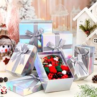 Caja de Regalo Holográfica Portátil Impermeable de Cartón con Tapa y Base, Laminación Brillante y Lazo Plateado de Alta Gama