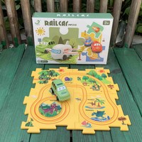 Promotion bas prix éducatif garçon jeu ensemble en plastique dinosaure électrique bricolage bloc de construction Train Rail voiture jouet Puzzle piste de course