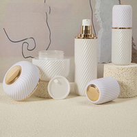 Paquets cosmétiques en verre personnalisés de 40ml 100ml 120ml de bonne qualité flacons à pompe de sérum de lotion blanc à rayures avec pot de crème de 100g