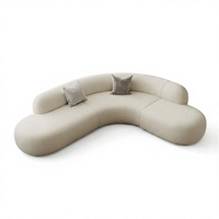 Canapé d'angle en tissu style crème, modulable, amovible et lavable, idéal pour hall d'hôtel et réception